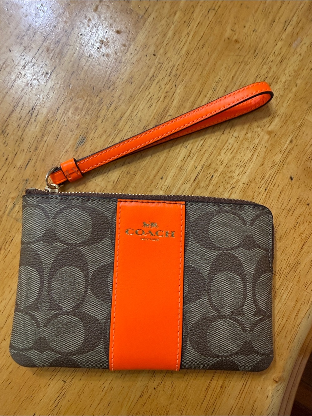Coach Brown Signature Wristlet with Bright Orange Stripe